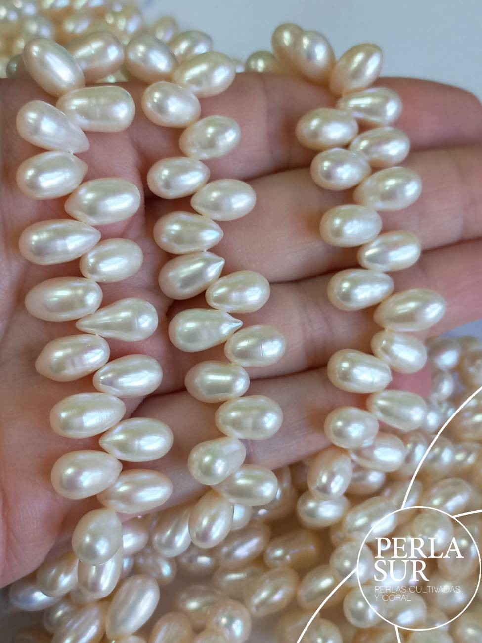 Hilo Perla Oval Cruzada 7x10mm Blanca